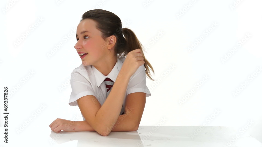 Young girl smiling and pointing to the side Young girl smiling and pointing to the side
