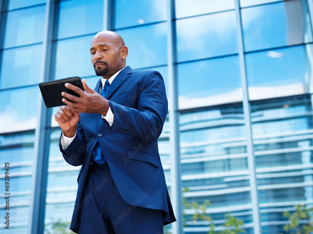 african american businnesman using tablet african american businnesman using tablet