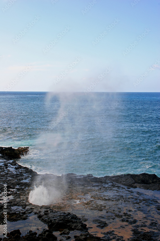 Water Shooting Upward From Spouting Horn Blowhole Kauai Hawaii