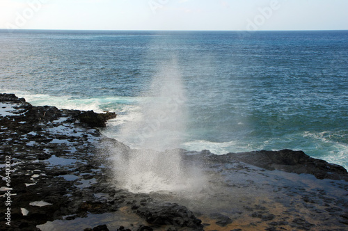 Water Shooting Upward From Spouting Horn Blowhole Kauai Hawaii