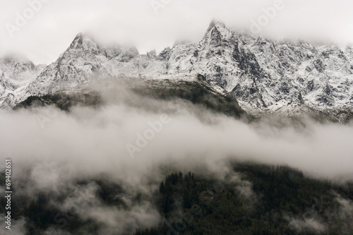 alpine peaks obscured by cloud inversion