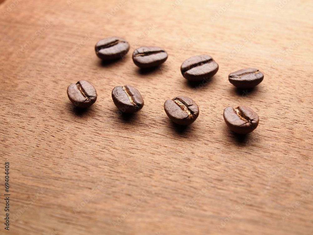 Coffee crop beans on wood texture Coffee crop beans on wood texture