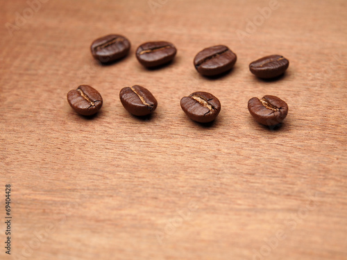 Coffee crop beans on wood texture