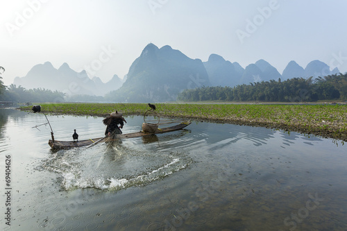 Cormorant, fish man and Li River scenery sight 