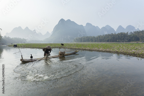 Cormorant, fish man and Li River scenery sight 