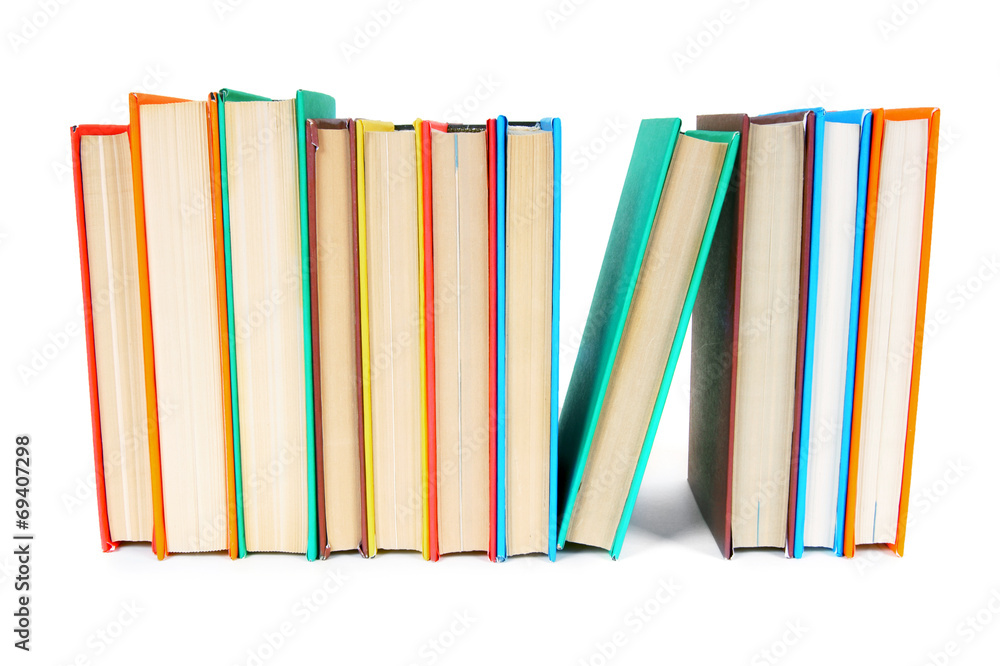 Multi-coloured books. On white background. Multi-coloured books. On white background.