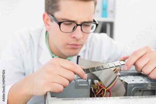 Technician working on broken cpu
