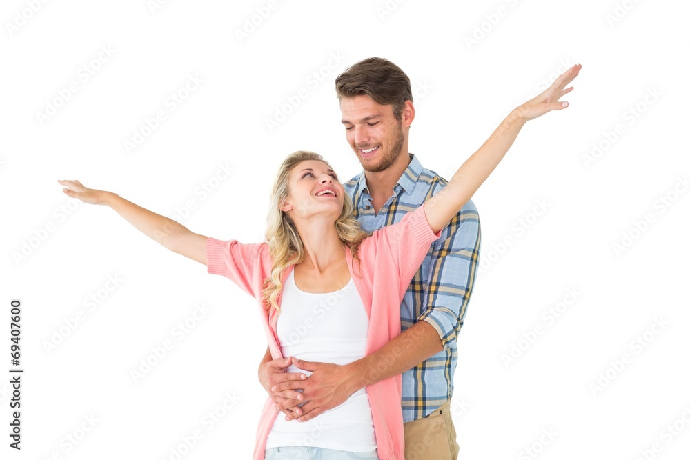 Fototapeta premium Attractive young couple smiling and embracing
