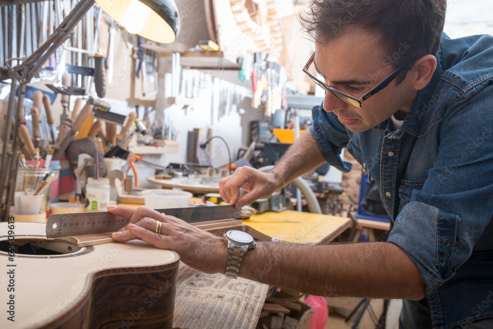 One luthier working on his next guitar One luthier working on his next guitar