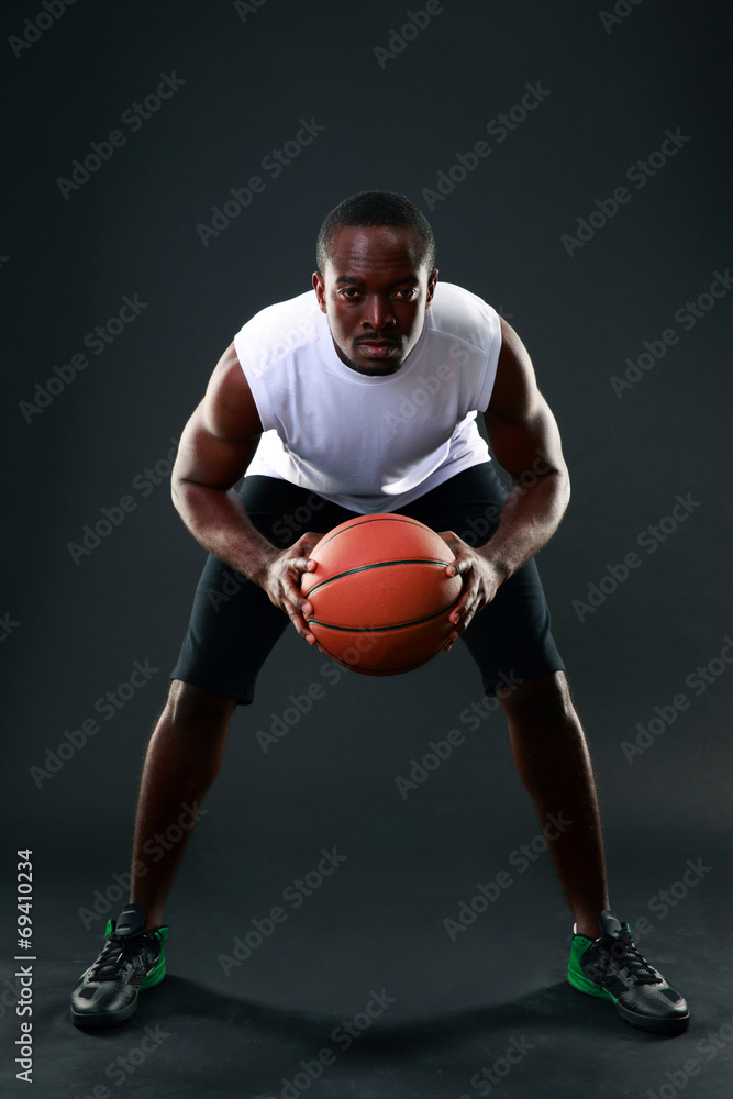 African American male playing basketball