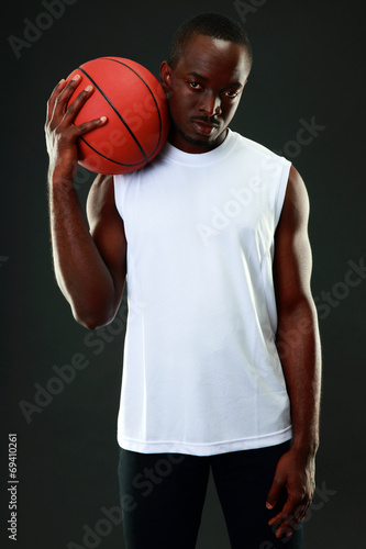Portrait of African American man with basketball