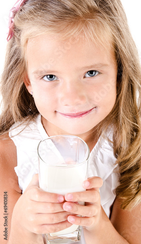 Smiling little girl drinking milk isolated