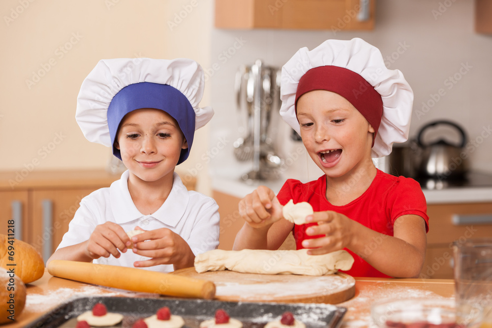 little children making cakes and talking. little children making cakes and talking.