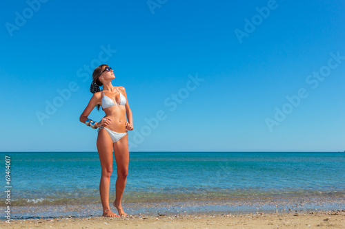 woman in bikini, outdoor on the beach © Netfalls