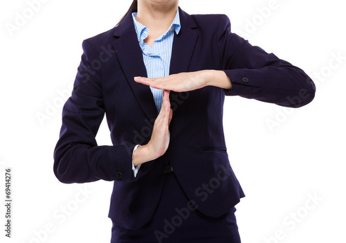 Businesswoman with pause hand gesture