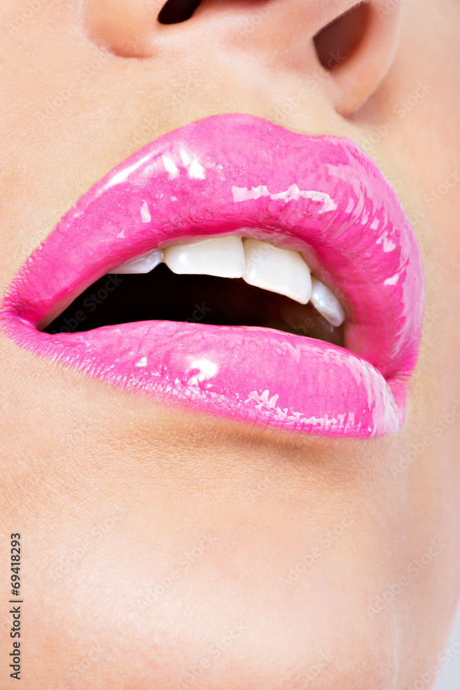 Naklejka premium Closeup Beautiful female lips with pink lipstick