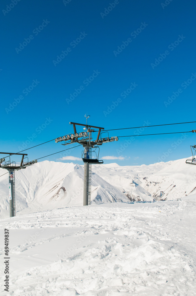 Skilift on ski resort during winter on bright day Skilift on ski resort during winter on bright day