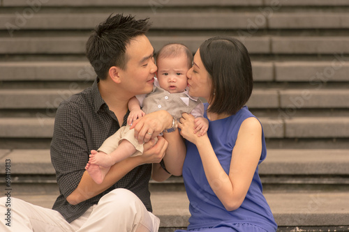 Young Asian Chinese family with 5 month old son photo