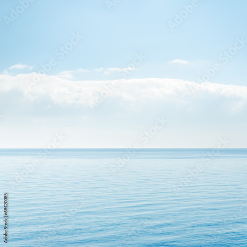 light cloud over blue sea