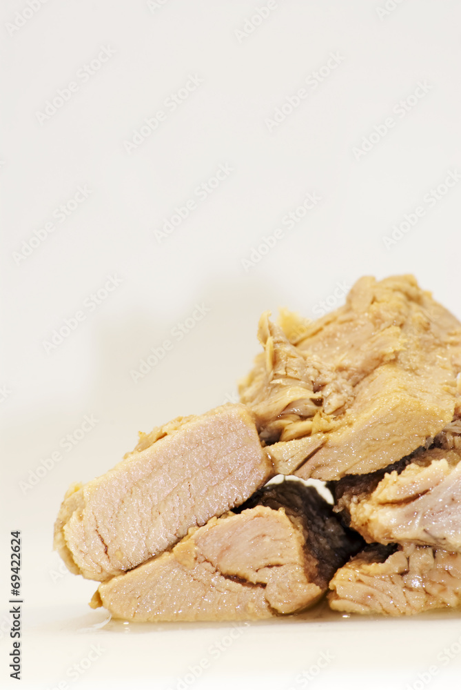 Group of pieces of tuna in olive oil Group of pieces of tuna in olive oil