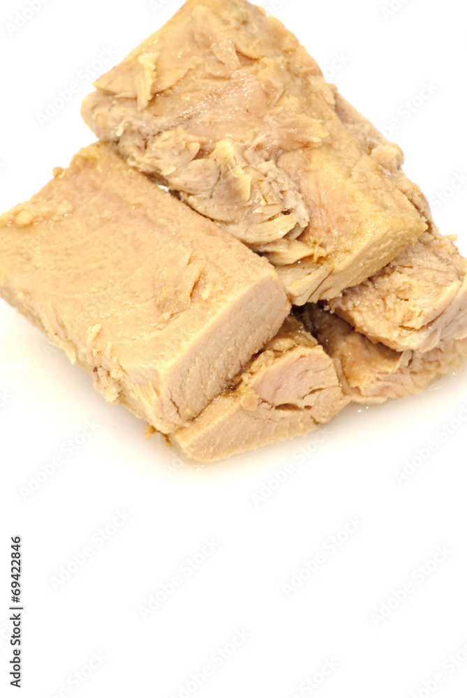 Group of pieces of tuna in olive oil Group of pieces of tuna in olive oil