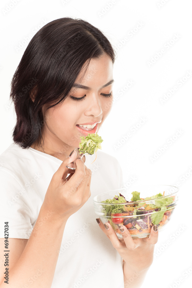 Pretty girl eating fresh vegetable salad Pretty girl eating fresh vegetable salad