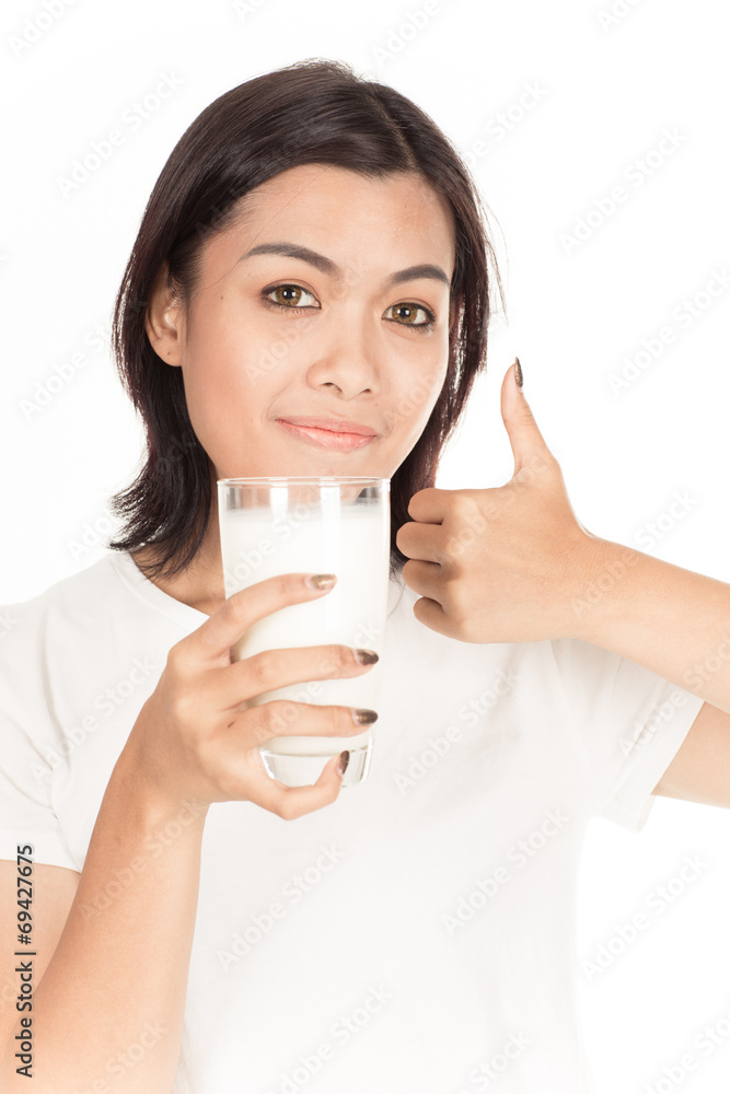 Laughing young woman with a glass of milk Laughing young woman with a glass of milk