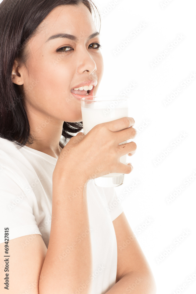 Laughing young woman with a glass of milk Laughing young woman with a glass of milk