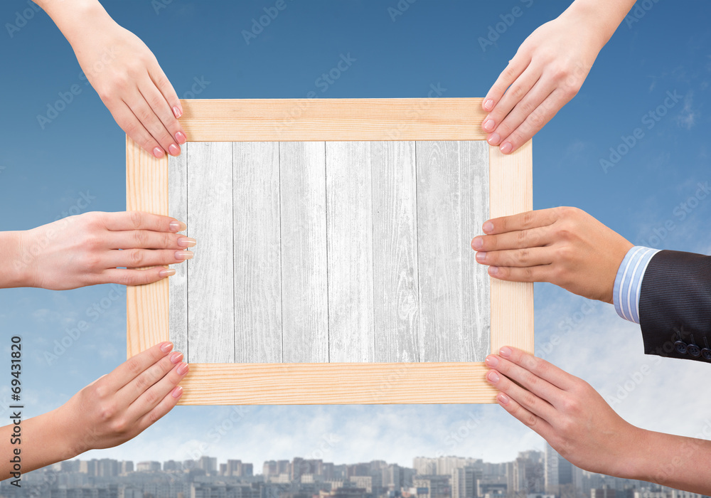 Hands holding frame Hands holding frame