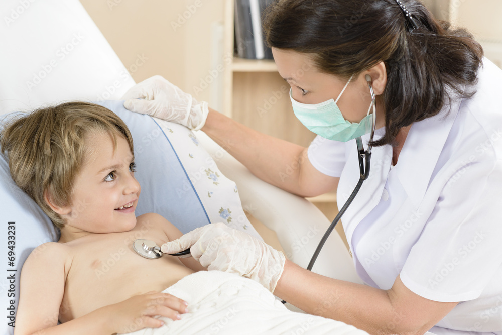 Doctor consulting a little boy Doctor consulting a little boy