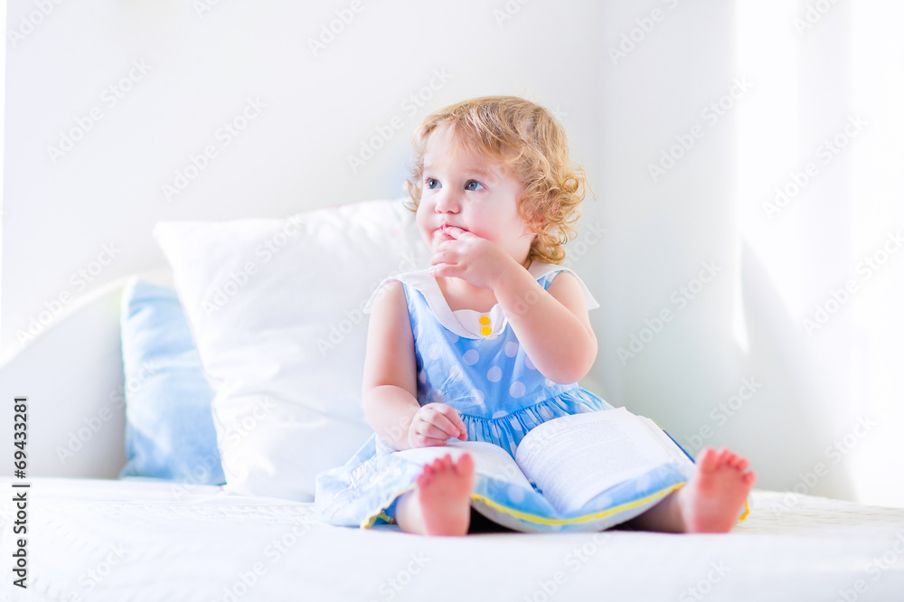 Little cute girl reading a book Little cute girl reading a book