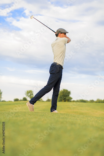 Young man playing golf