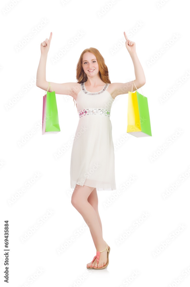 Naklejka premium Woman after shopping spree on white