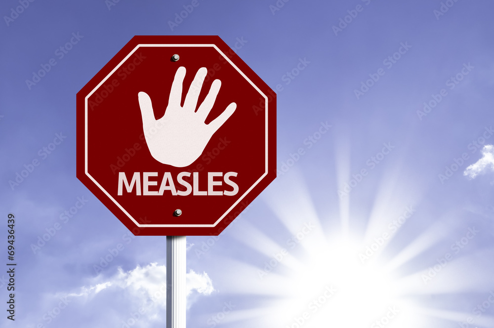 Stop Measles red sign with sun background Stop Measles red sign with sun background