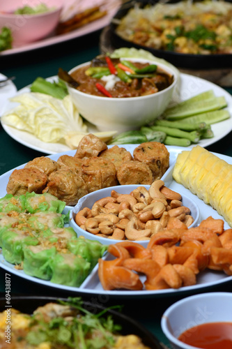 Set of Thai and Chinese Food on Table