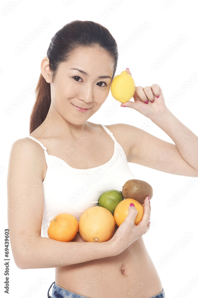 Portrait of beautiful beauty -up and holding mixed fruit Portrait of beautiful beauty -up and holding mixed fruit