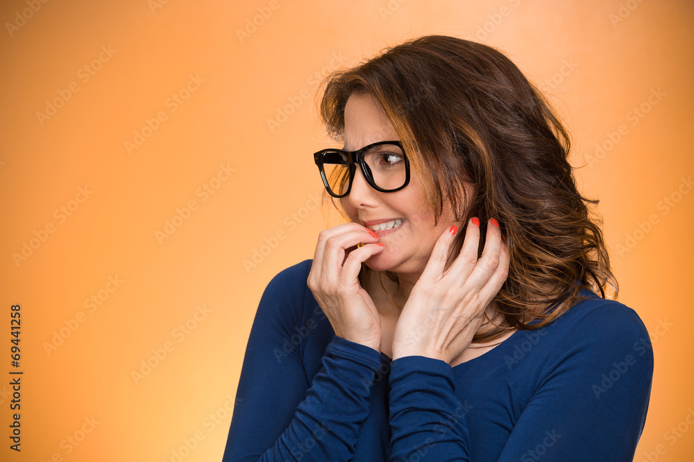 Woman biting her fingernails, craving something, anxious Woman biting her fingernails, craving something, anxious