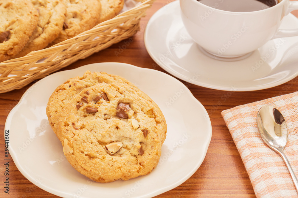 Chocolate chip cookie with almond and coffee cup, Filtered image Chocolate chip cookie with almond and coffee cup, Filtered image
