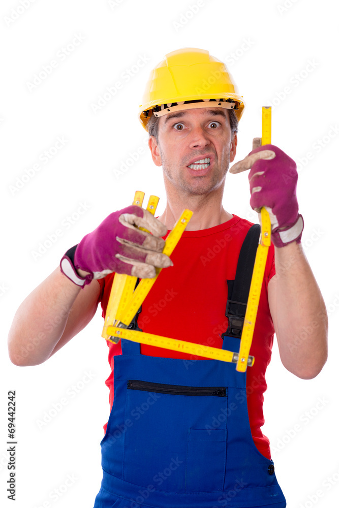 worker with yardstick is over-worked
