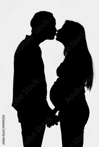 young couple expecting a baby- silhouette