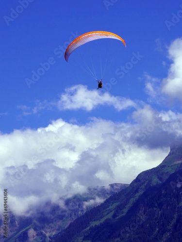 paragliding, parachute over the mountain
