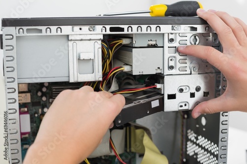 Technician working on broken computer