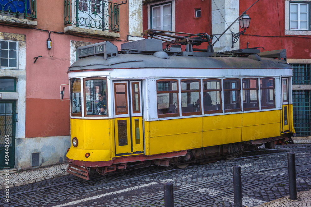 Vintage yellow tram, symbol of Lisbon, Portugal
