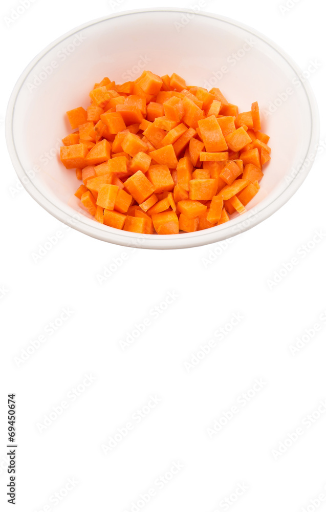 Chopped carrot in a bowl over white background Chopped carrot in a bowl over white background