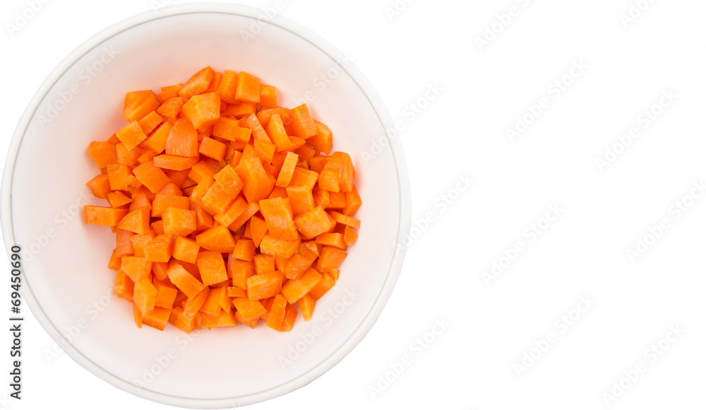 Chopped carrot in a bowl over white background Chopped carrot in a bowl over white background