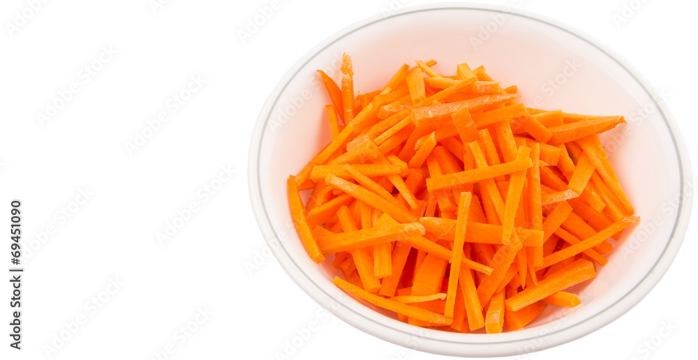 Chopped carrot in a bowl over white background Chopped carrot in a bowl over white background
