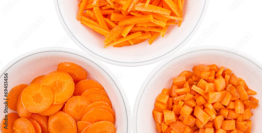Different style of chopped carrots in white bowls Different style of chopped carrots in white bowls