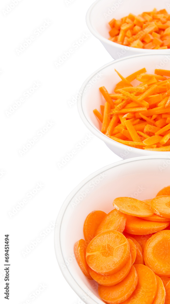 Different style of chopped carrots in white bowls Different style of chopped carrots in white bowls