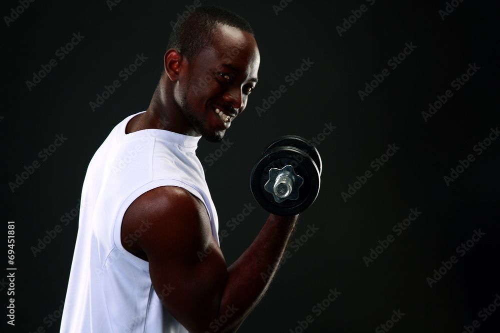 handsome african sports man over black background