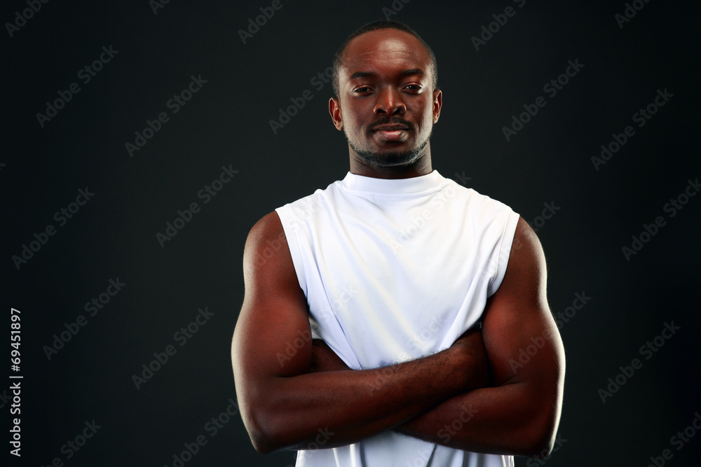 handsome african sports man over black background